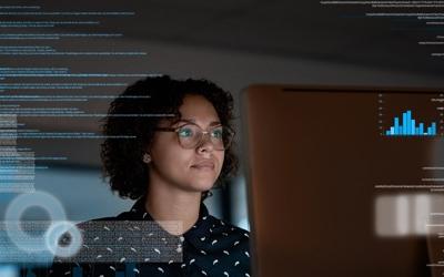Woman working with analytics at a computer